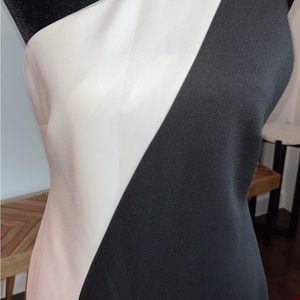 Scuba material one shoulder two toned side zip.